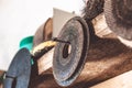 Circles for angle grinders are on wooden shelves. The concept of tools and repair work