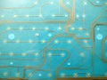 Circuit board made of plastic with circuit traces on blue background. The concept of technology, computing, electronics Royalty Free Stock Photo