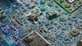The circuit board of the motherboard is covered with drops of water in blue-green tones