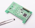 Circuit board and tweezers Royalty Free Stock Photo