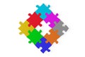 Circular arrangement of multi colored jigsaw puzzle pieces on white background flat lay from above, brainstorming, software module