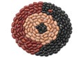 Circular arrangement of red, pinto, and black beans on white background Royalty Free Stock Photo