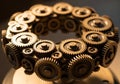 A circular assembly of interlocking gears, each with a metallic finish, arranged to form a complex Royalty Free Stock Photo