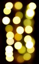 Circular bokeh lights background in golden tones Royalty Free Stock Photo