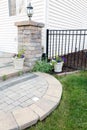 Circular brick step onto an outdoor patio