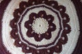 Circular brown and white crochet pattern for handmade pillow Royalty Free Stock Photo
