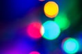 Circular colored bokeh over dark background