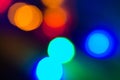 Circular colored bokeh over dark background