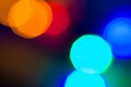 Circular colored bokeh over dark background