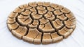 A circular, cracked pattern resembling dried mud or clay sits on a Royalty Free Stock Photo