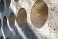 Circular Cutouts in a Concrete Wall Royalty Free Stock Photo