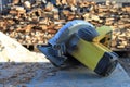 Circular electric saw in sawdust, pile of fresh blurred wooden