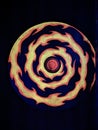 Circular fire sign glowing at night time in game room