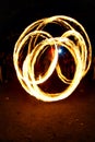 Circular fire trails from a fire juggler Royalty Free Stock Photo