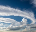 Circular formation of clouds creating a striking visual effect against a clear blue sky. Royalty Free Stock Photo
