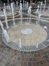 Circular Fountain with Water Jets in Urban Public Square Setting Royalty Free Stock Photo