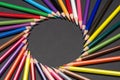Circular frame made of colored pencil tips Royalty Free Stock Photo