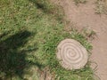 circular garden stone with green grass