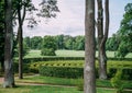 Circular green bushes maze in summer park. Royalty Free Stock Photo