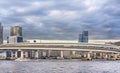 Circular highway leading to the Rainbow Bridge of Odaiba bay in Tokyo