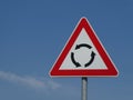 Circular Intersection warning traffic road sign roundabout Royalty Free Stock Photo