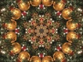 Festive kaleidoscope pattern of red and gold ornaments on Christmas tree branches Royalty Free Stock Photo