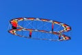 Circular kite flying in a blue sky