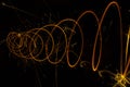 Circular lights with sparks on a black background