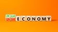 Circular or linear economy symbol. Concept words Circular economy or Linear economy on blocks. Beautiful orange table orange