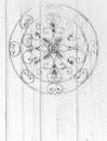 Circular metal ornate medallion grayscale