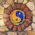 Mosaic symbol of Yin and yang on stone wall Royalty Free Stock Photo