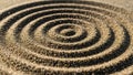 Circular patterns in sand forms concentric rings, creating a textured and symmetrical design. The Royalty Free Stock Photo