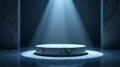 A circular platform with a marbled texture is illuminated by a focused beam of light, casting a shadow on the darkened surrounding Royalty Free Stock Photo