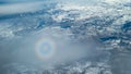 Circular rainbow seen out of airplane window called glory