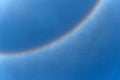 Circular rainbow surround the sun on blue sky. Sun haloÃ¢â¬â¹ phenomenon Royalty Free Stock Photo