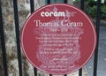 Circular red plaque for Thomas Coram