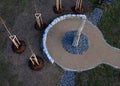circular rest stop with an obelisk at the end of path in the park.
