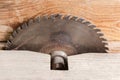 Circular saw blade for cutting wood on old table saw Royalty Free Stock Photo