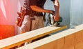 Circular Saw. Carpenter Using Circular Saw for wood beam Royalty Free Stock Photo