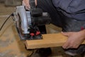 Circular saw carpenter using for wood beam Royalty Free Stock Photo