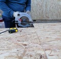 Circular Saw. Carpenter Using Circular Saw for wood Royalty Free Stock Photo