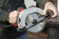 Circular saw in human hands.A tool for working on wood