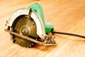 Circular saw or power saw on wooden background tool woodcraft object isolated Royalty Free Stock Photo