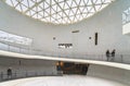 Circular slope under a skylight along a chronogical wall leading to the Nagasaki Atomic Bomb Museum.