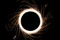 Circular sparkling light and sparks with outside Sparkles trails made by using sparkle stick. Look like conceptual black hole and