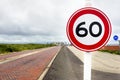 Circular Speed Limit Sign on a Brick Road Royalty Free Stock Photo