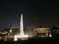 Circular waterjet fountain by night in Lima