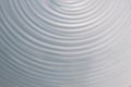 Circular wave motion in a fluid system. blue gray background for Royalty Free Stock Photo