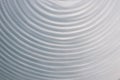 Circular wave motion in a fluid system. blue gray background for