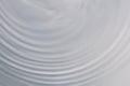 Circular wave motion in a fluid system. blue gray background for